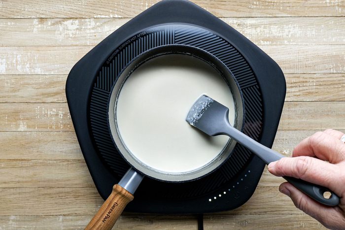 stirring liquid ingredient in saucepan