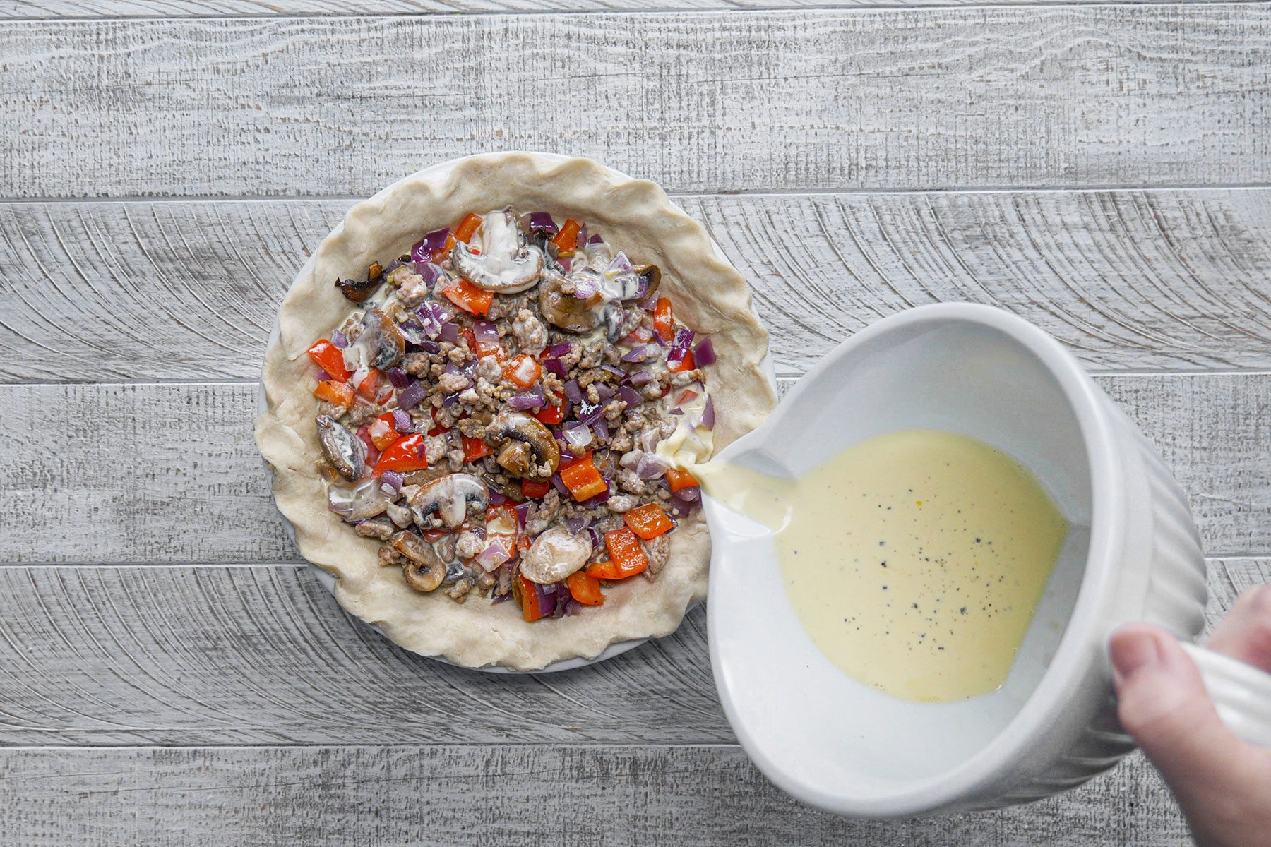 Pouring egg mixture of fillings