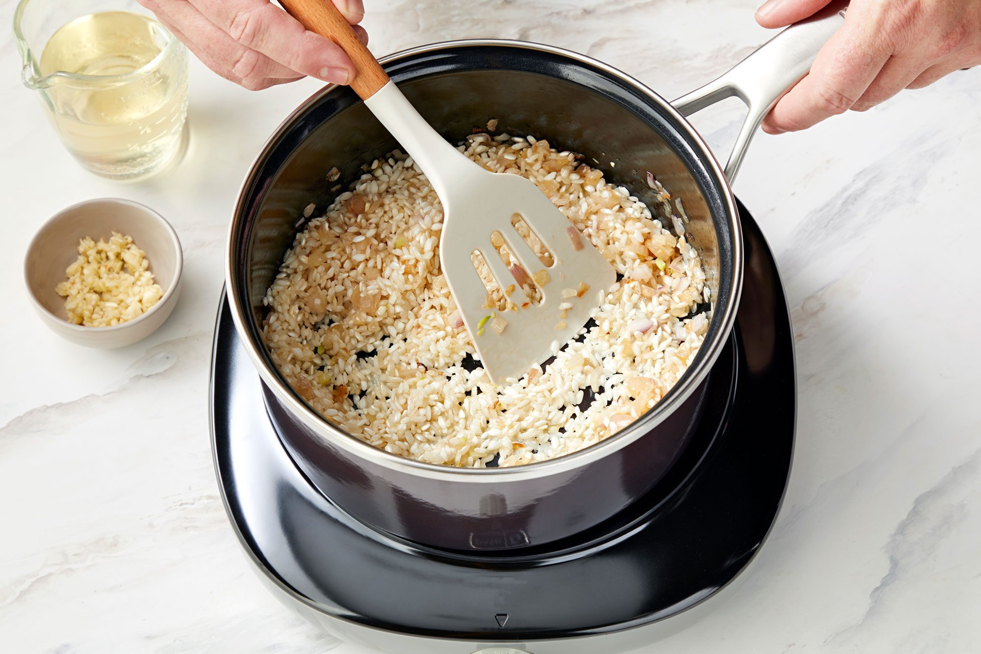 high angle shot of rice added in the saucepan