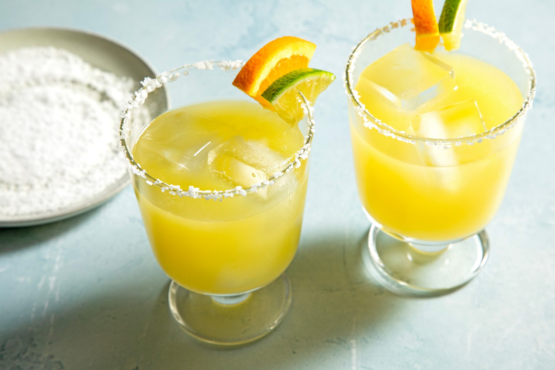 Two glass of Skinny Margaritas garnished with a lime slice