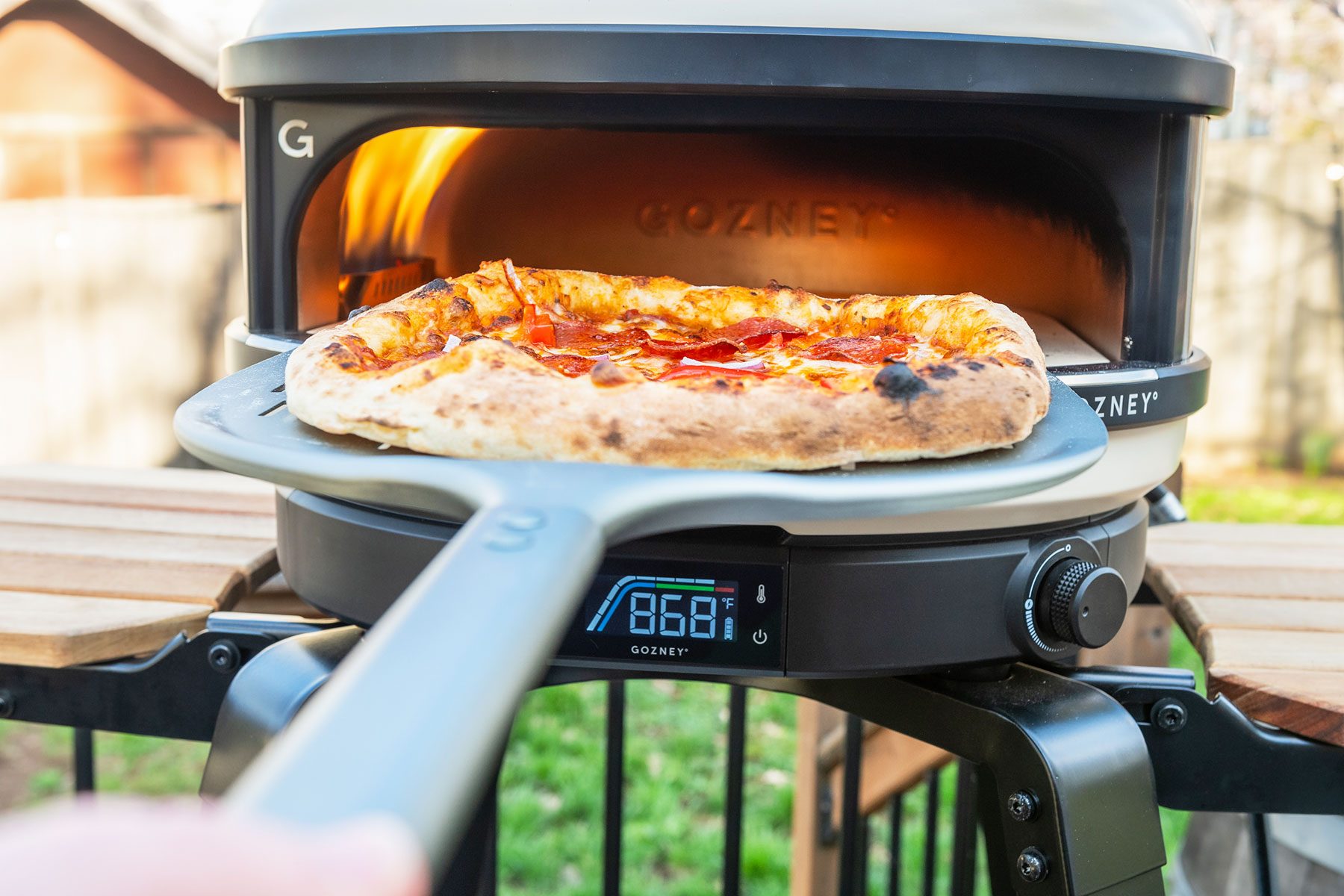 Using Pizza Peel to take out pizza from Gozney Arc Pizza Oven 