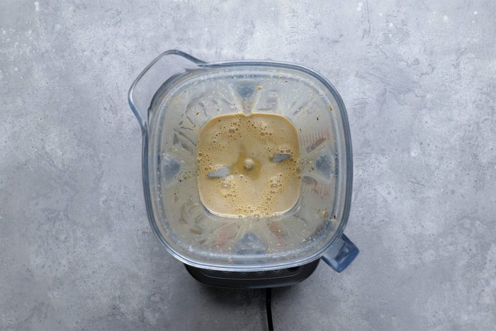 Overhead shot of place first 9 ingredients in a blender; cover and process until smooth; grey background