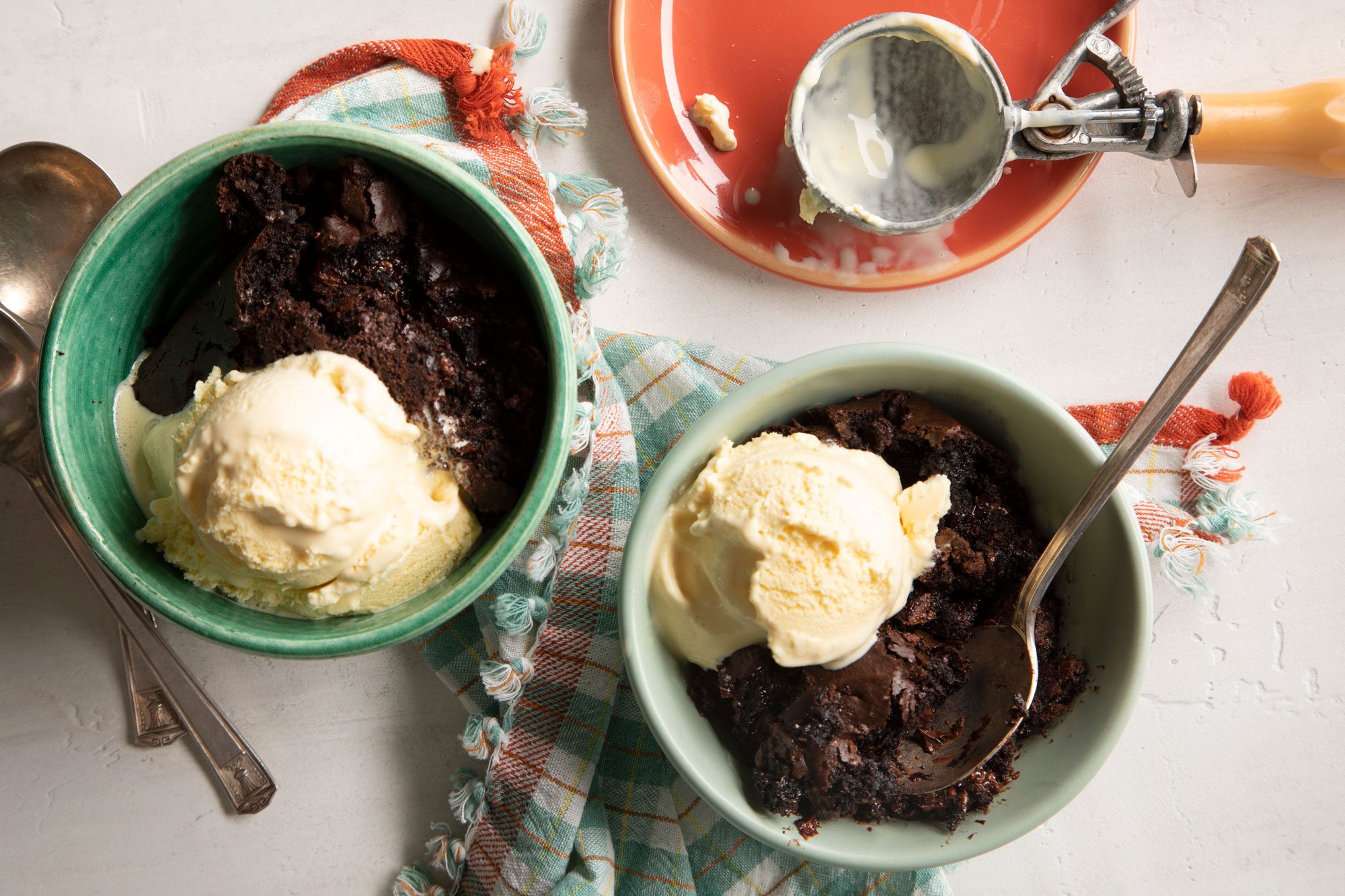 overhead shot of Chocolate Dump Cake with ice cream served in two small bowls
