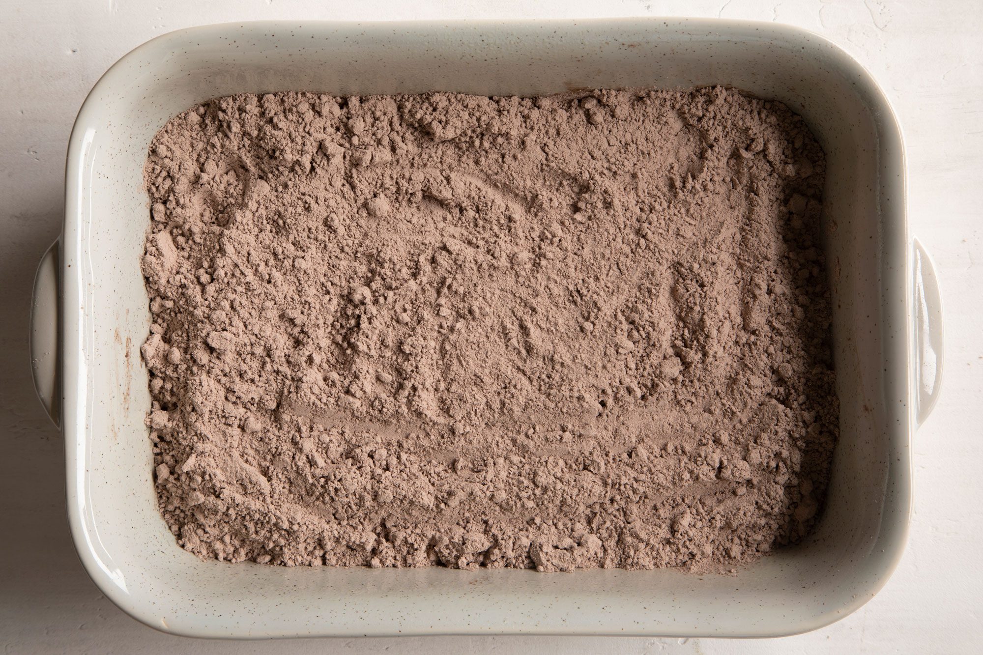 dry cake mix in a rectangular baking dish