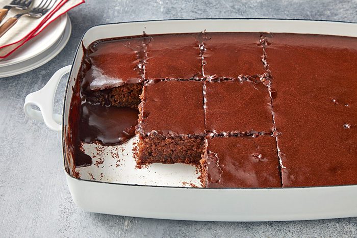 wide shot of cokecola cake in a baking dish cutted into pieces