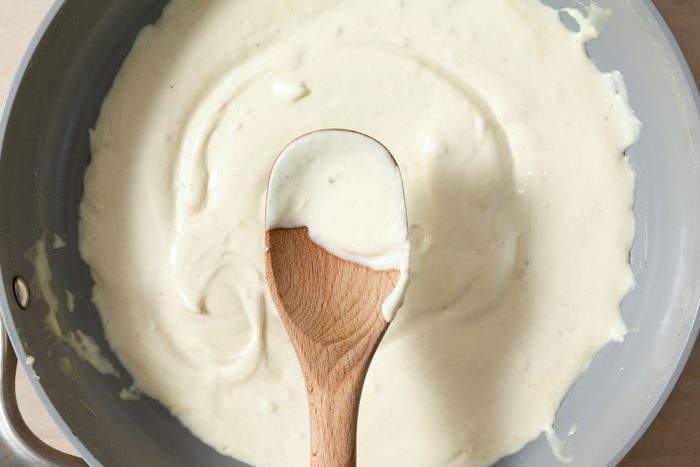 Add the heavy cream and garlic to the pan