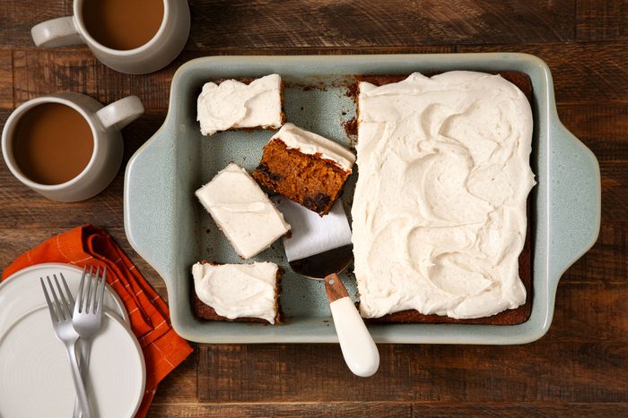 overhead shot of Pumpkin Bars in a baking dish on wooden surface