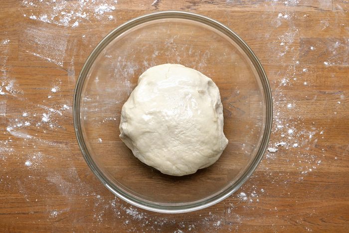 Place the dough in a large bowl that’s been greased with olive oil