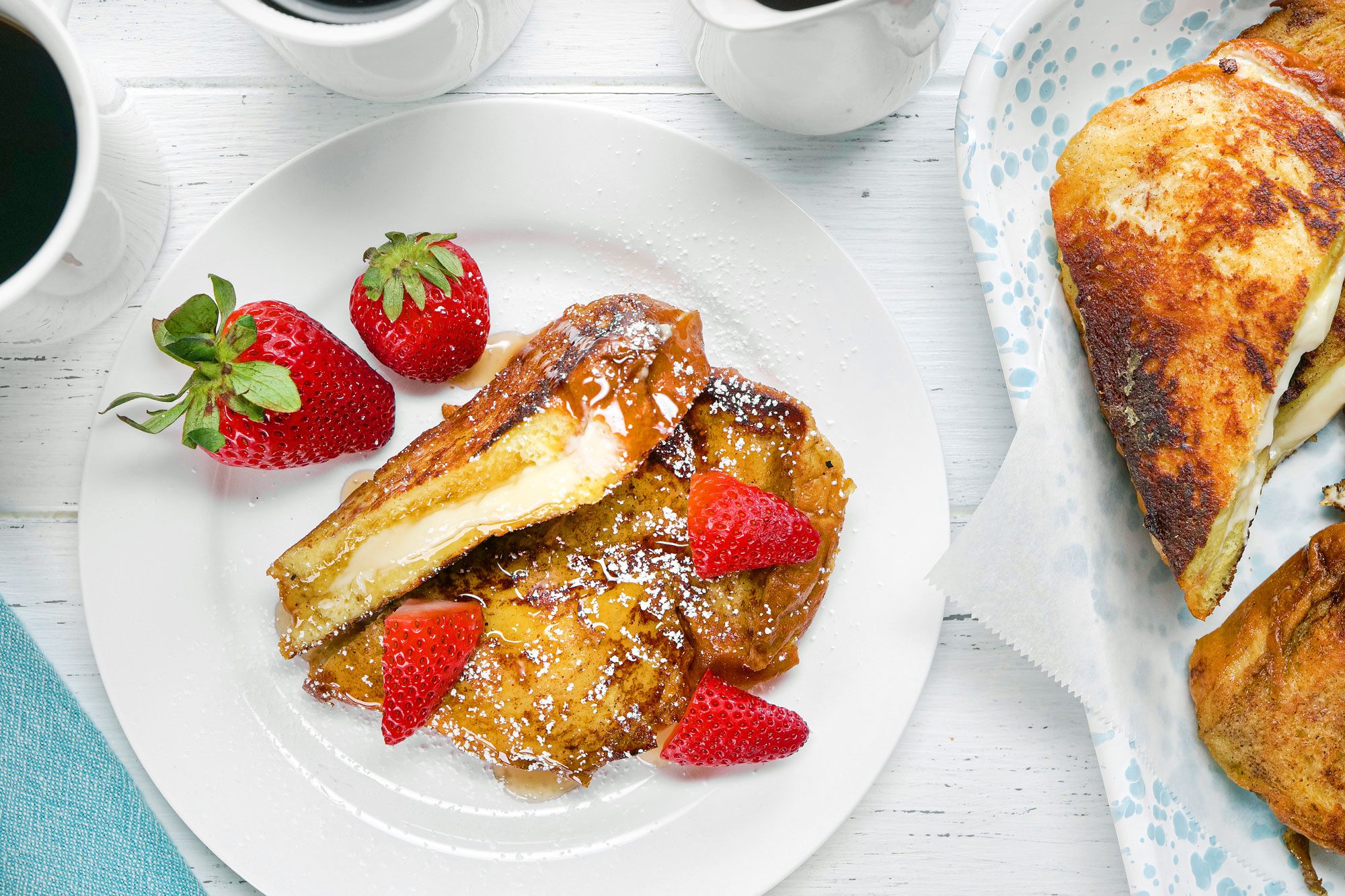 overhead shot of stuffed french toast topped with strawberries