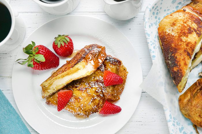 overhead shot of stuffed french toast topped with strawberries