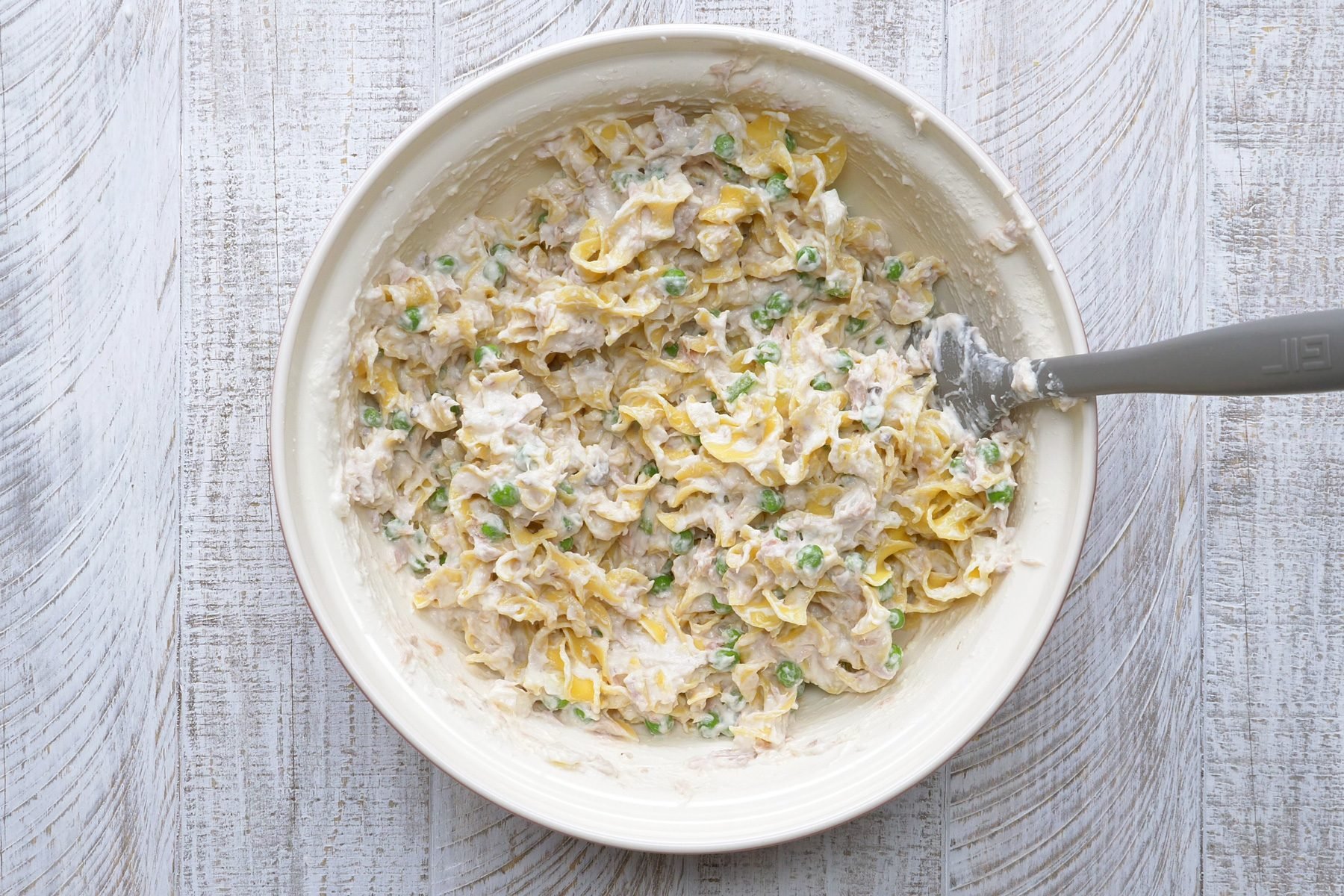 A bowl of bread crumbs with melted butter.