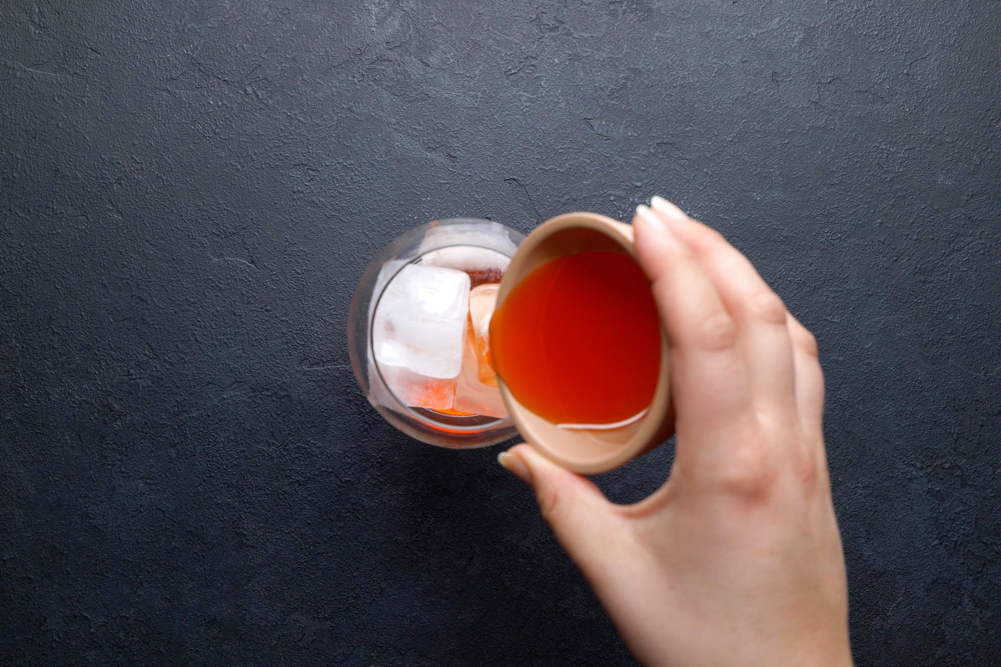 overhead shot of aperol poured into the wine glass