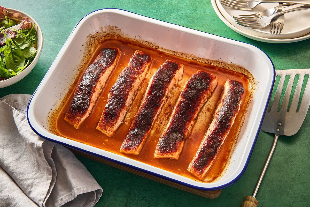 Baked barbecue salmon fillets in a baking tray