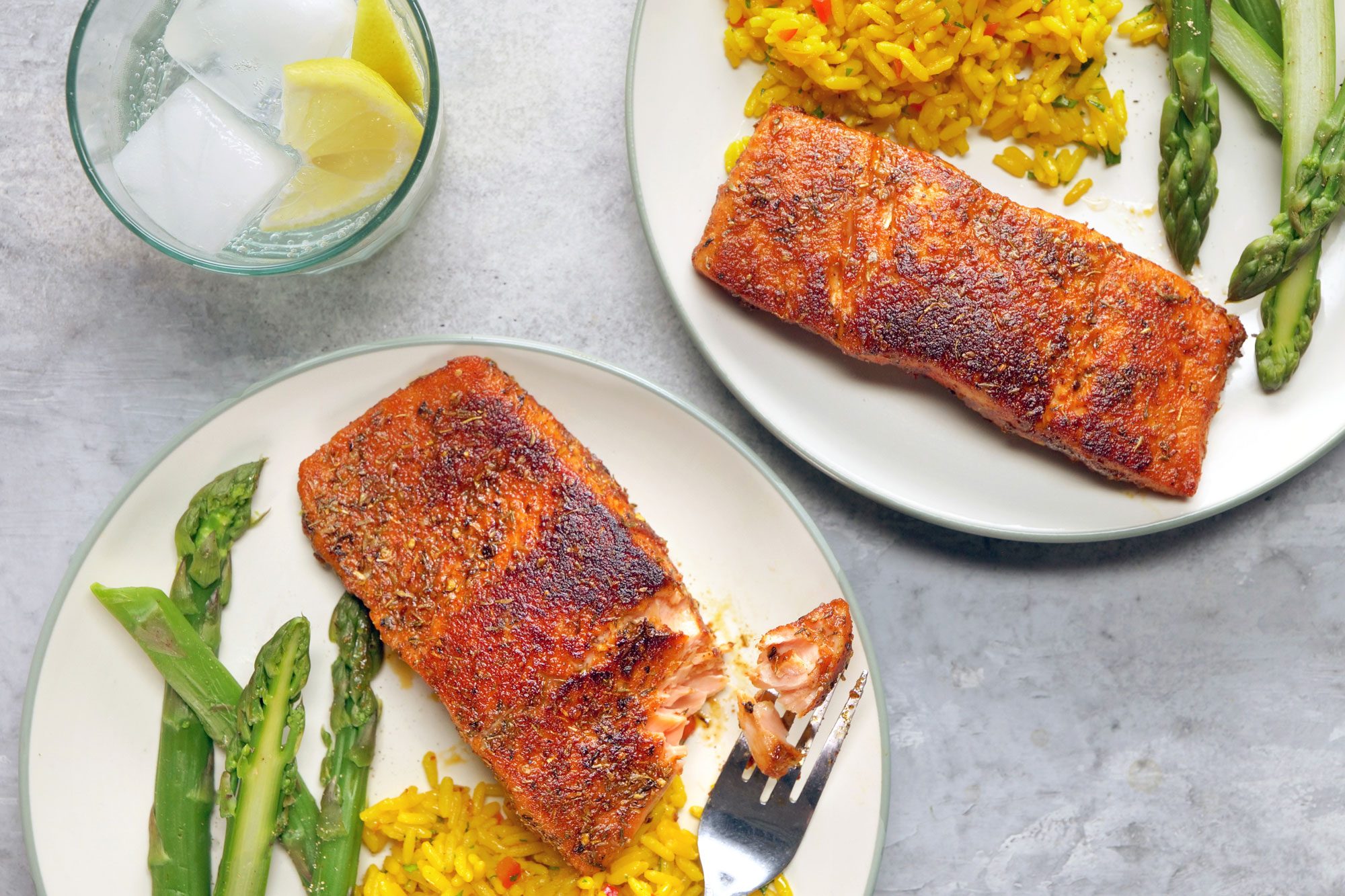 Delightful Blackened Salmon served with rice and lime water