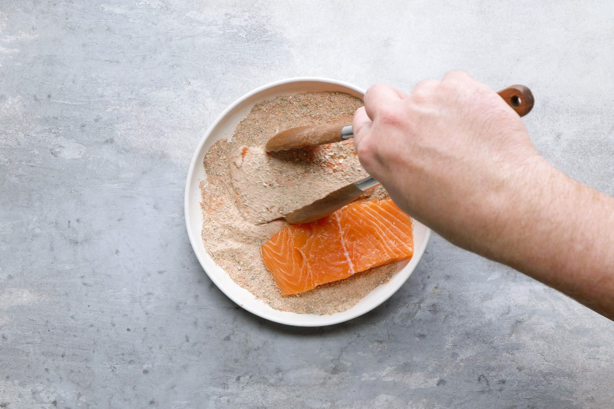 Dredge the salmon fillets through the spices