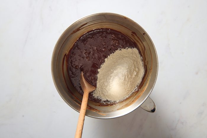 Overhead shot of brownie batter being mixed in a bowl