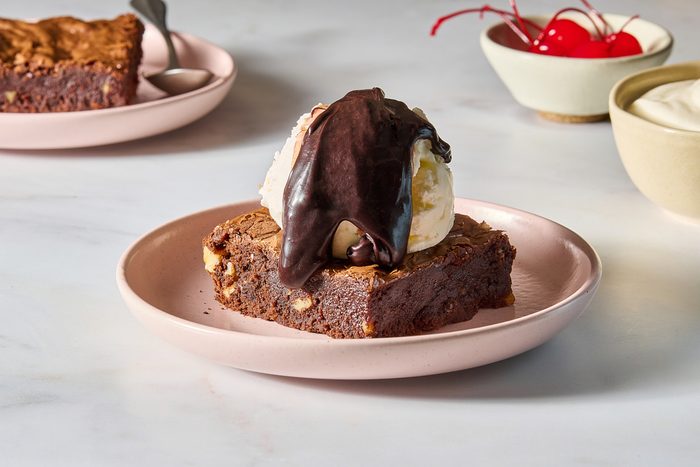 Chocolate brownie sundae made with vanilla ice cream and hot fudge sauce