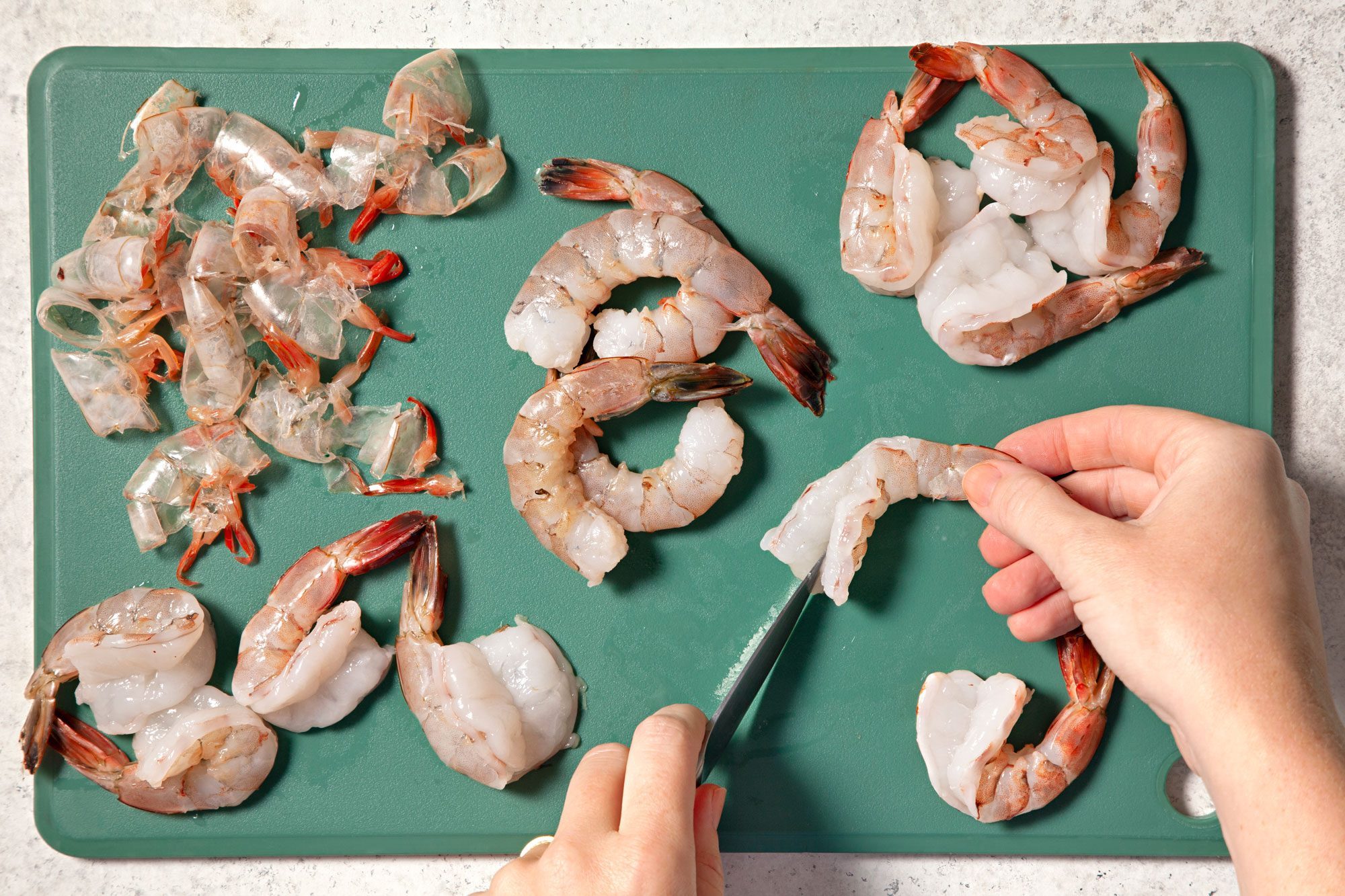 Peel and devein shrimp, leaving the tails on