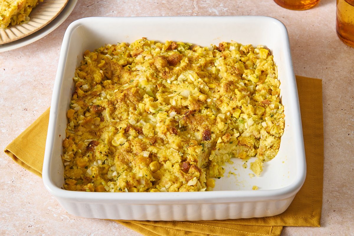Angled shot of easy cornbread dressing with a portion scooped out