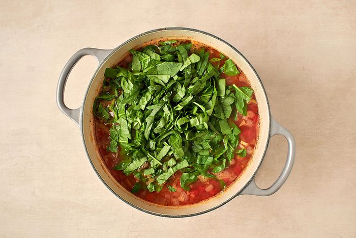 Remove bay leaf and add spinach.