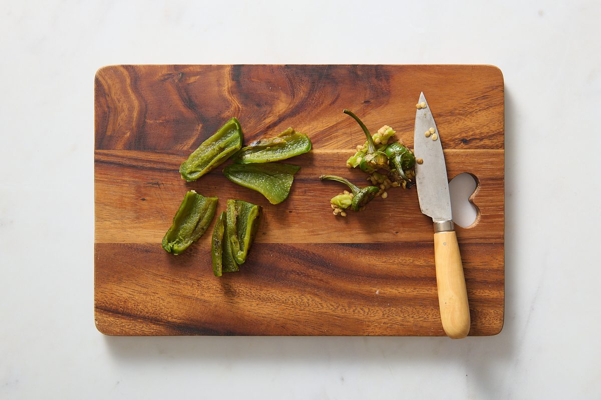 Preparing the blistered jalapeños
