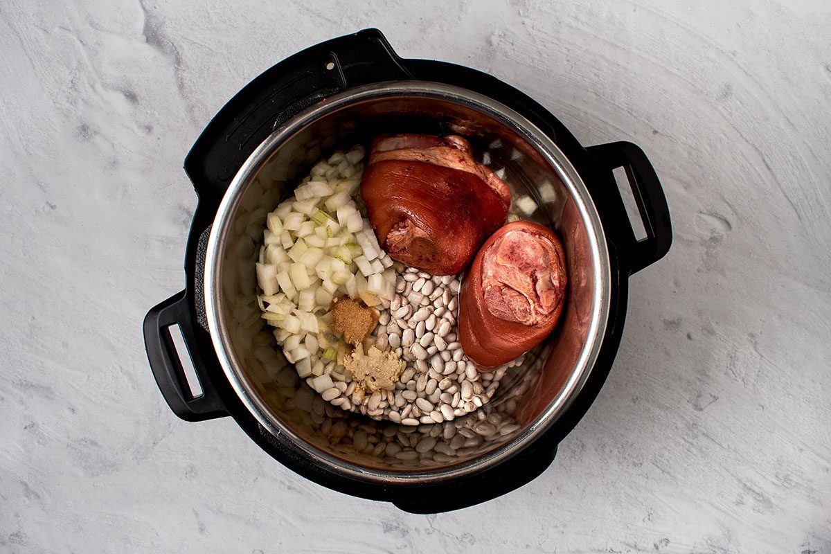 Briefly cook the beans and ham hocks.