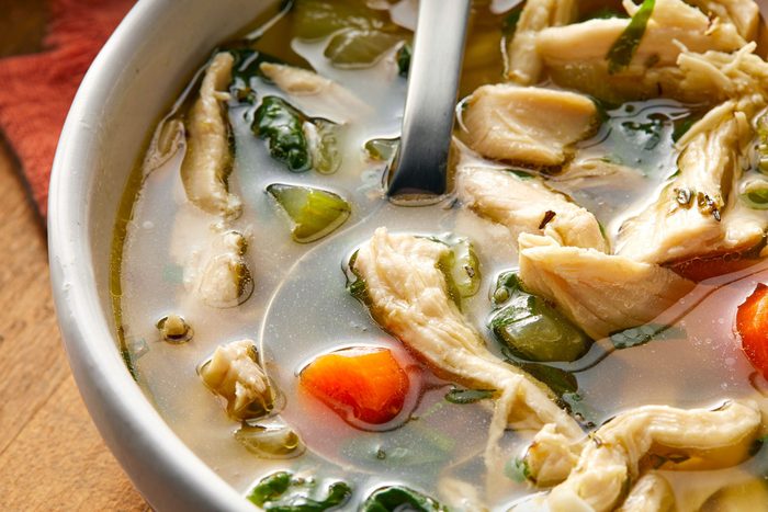 close shot of keto chicken soup served in a bowl