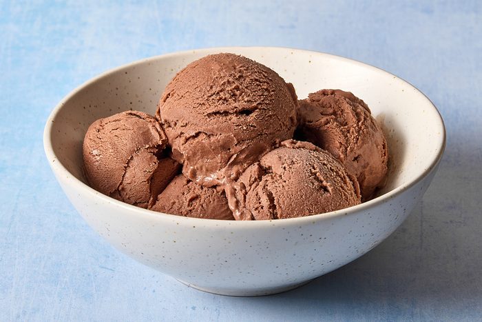 Closeup of several scoops of mocha ice cream in a bowl