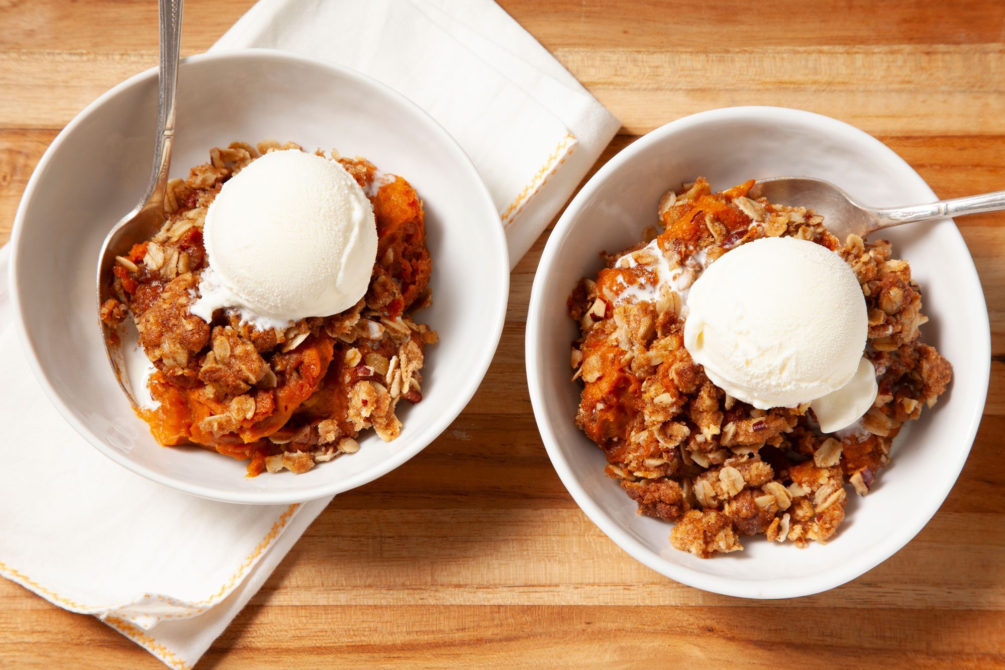 Pumpkin Crisp served in two bowls with spoon and napkin