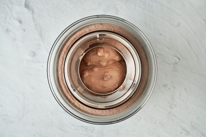 Churn rocky road ice cream in ice cream maker