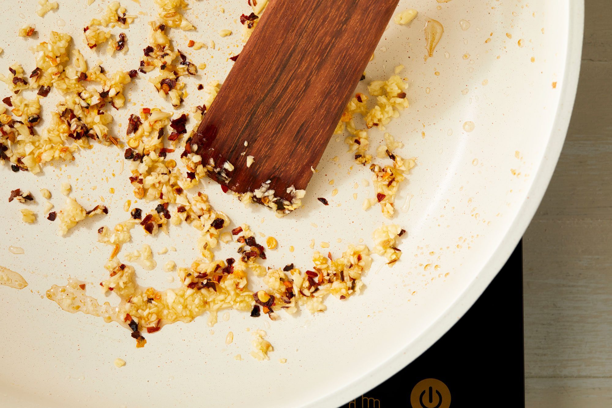 Cook and stir garlic and red pepper flakes until fragrant