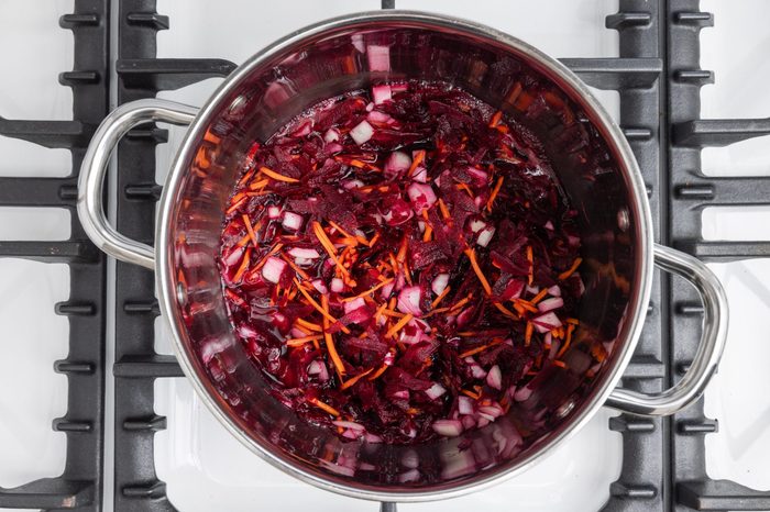 Carrots, beets and onions cooking in water.