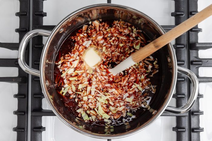 Beef broth, cabbage and butter added to the carrots and beets mix.