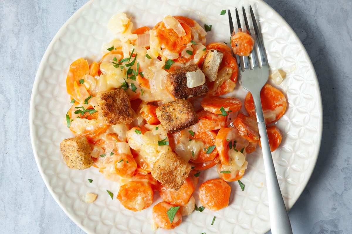 Taste of Home Carrot Casserole overhead angle on blue gray surface