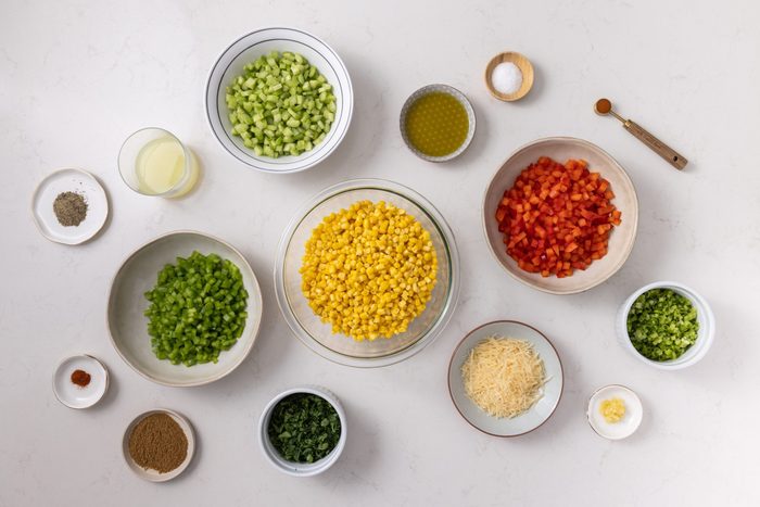 Ingredients for colorful corn salad on kitchen counter