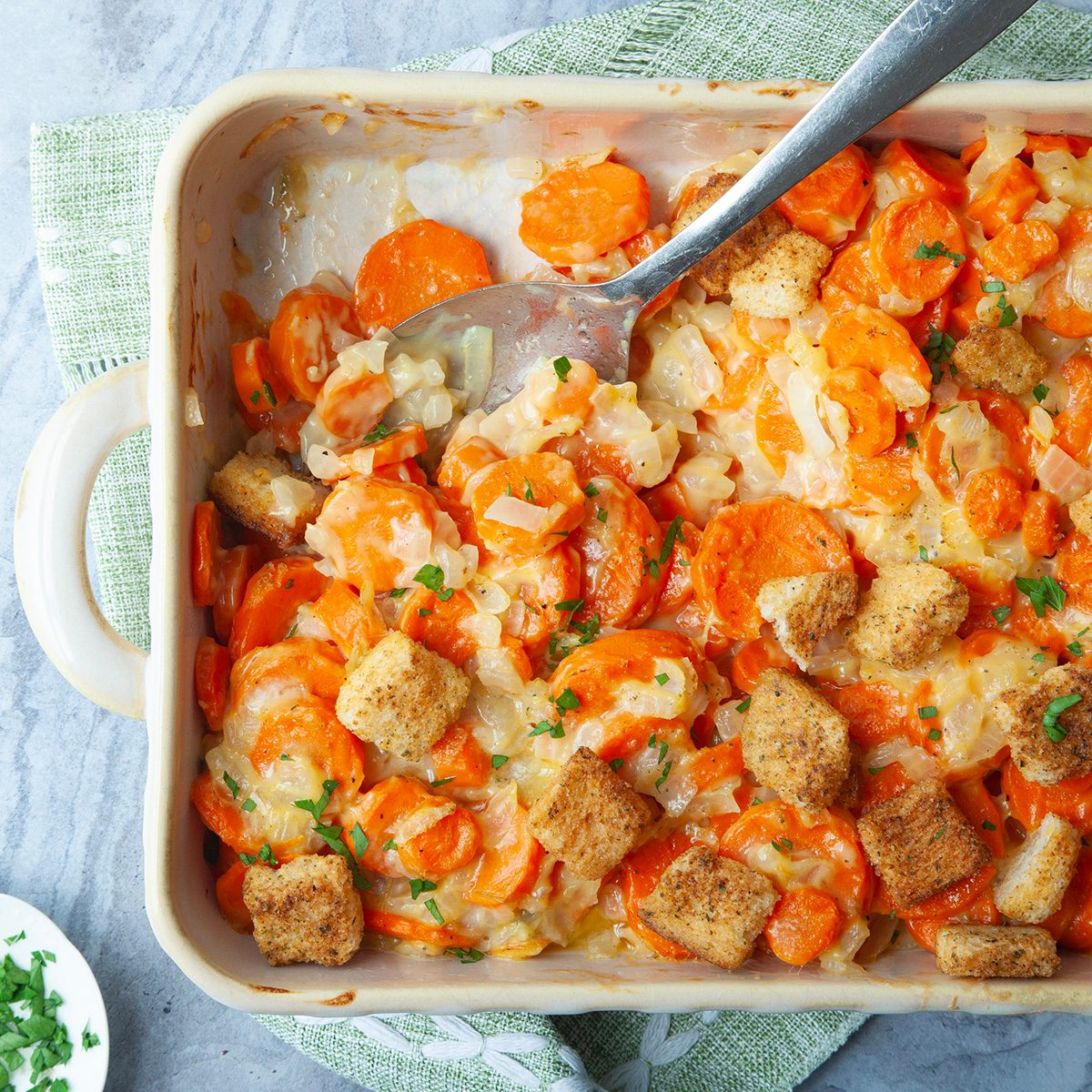 Taste Of Home Carrot Casserole Overhead Angle On Blue Gray Surface