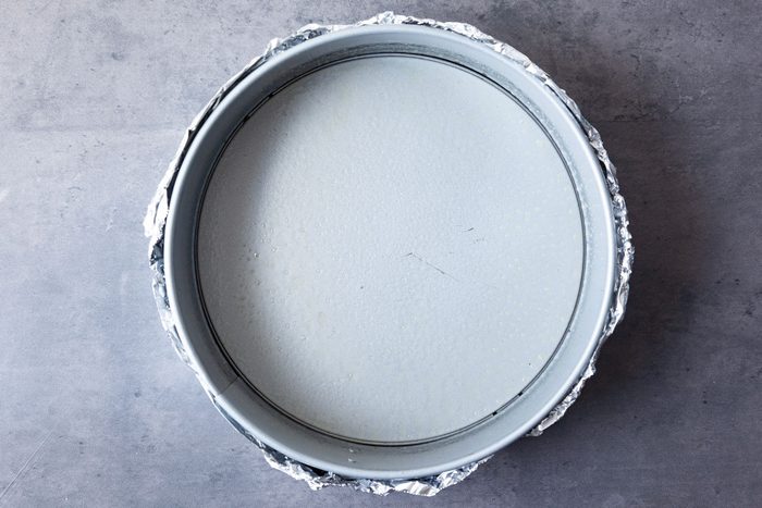 Step 1 of Taste of Home Eggnog Cheesecake is to wrap the pan in a double thickness of foil to create a water barrier