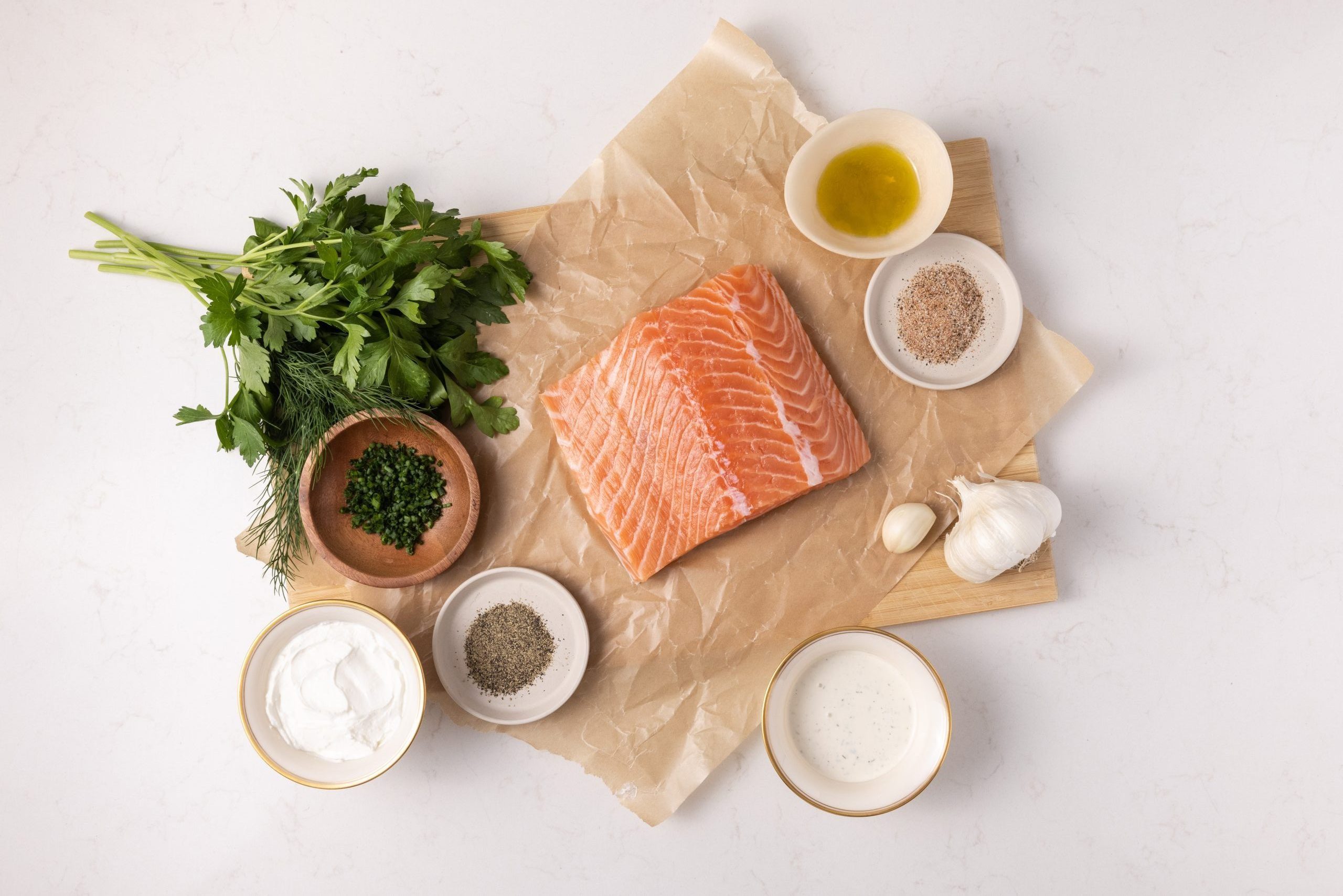 Ingredients for herb grilled salmon on kitchen counter.