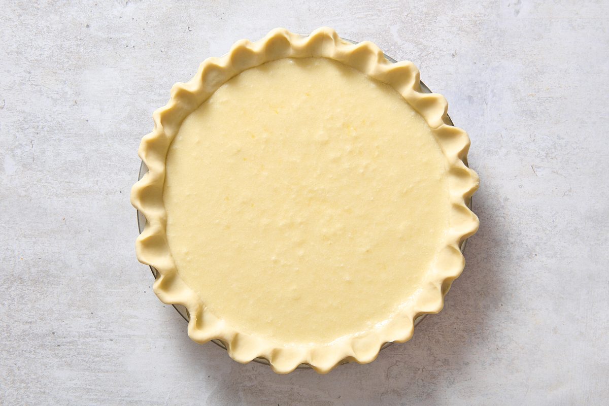 Lemon custard poured into pie crust