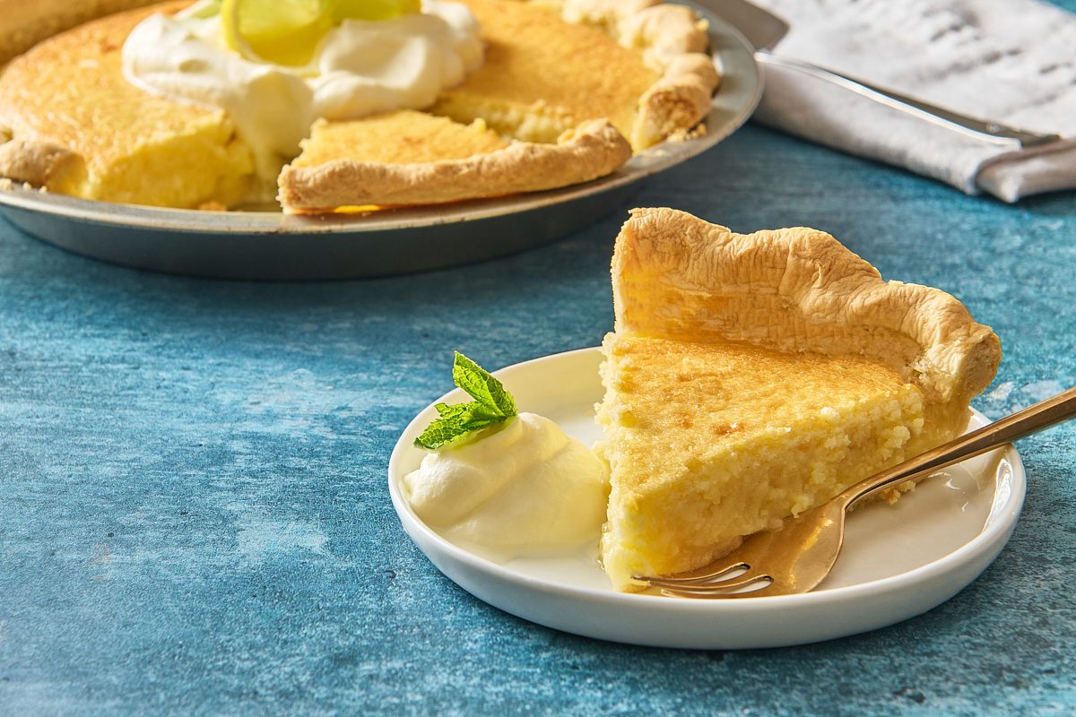 Closeup of a slice of lemon custard pie on a plate