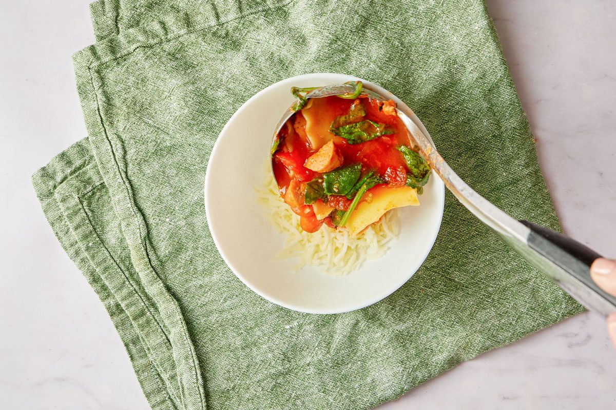 serving slow cooker soup into a bowl