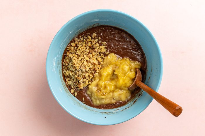Taste of Home Banana Brownies recipe photo of combining brownie batter, walnuts, and bananas.