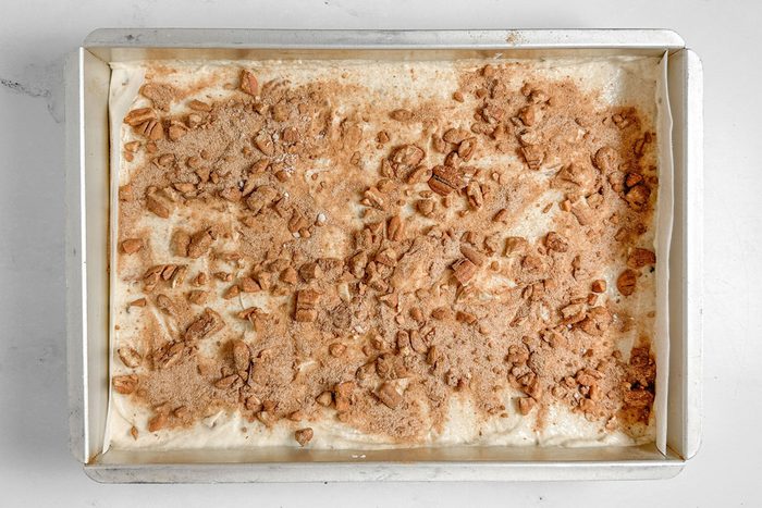 Taste of Home Banana Coffee Cake in a baking pan on a marble surface