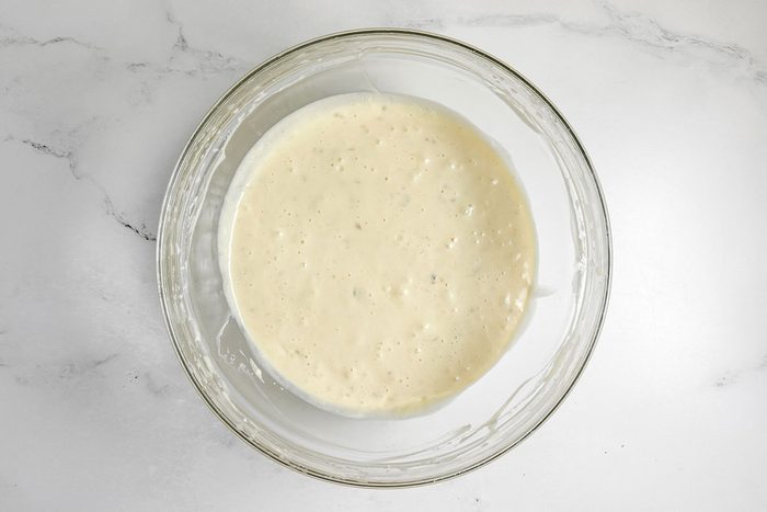 Batter for Taste of Home Banana Coffee Cake in a glass bowl on a marble surface