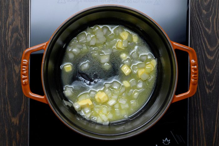 overhead shot; wooden background; In a small saucepan, saute onion in butter until tender;