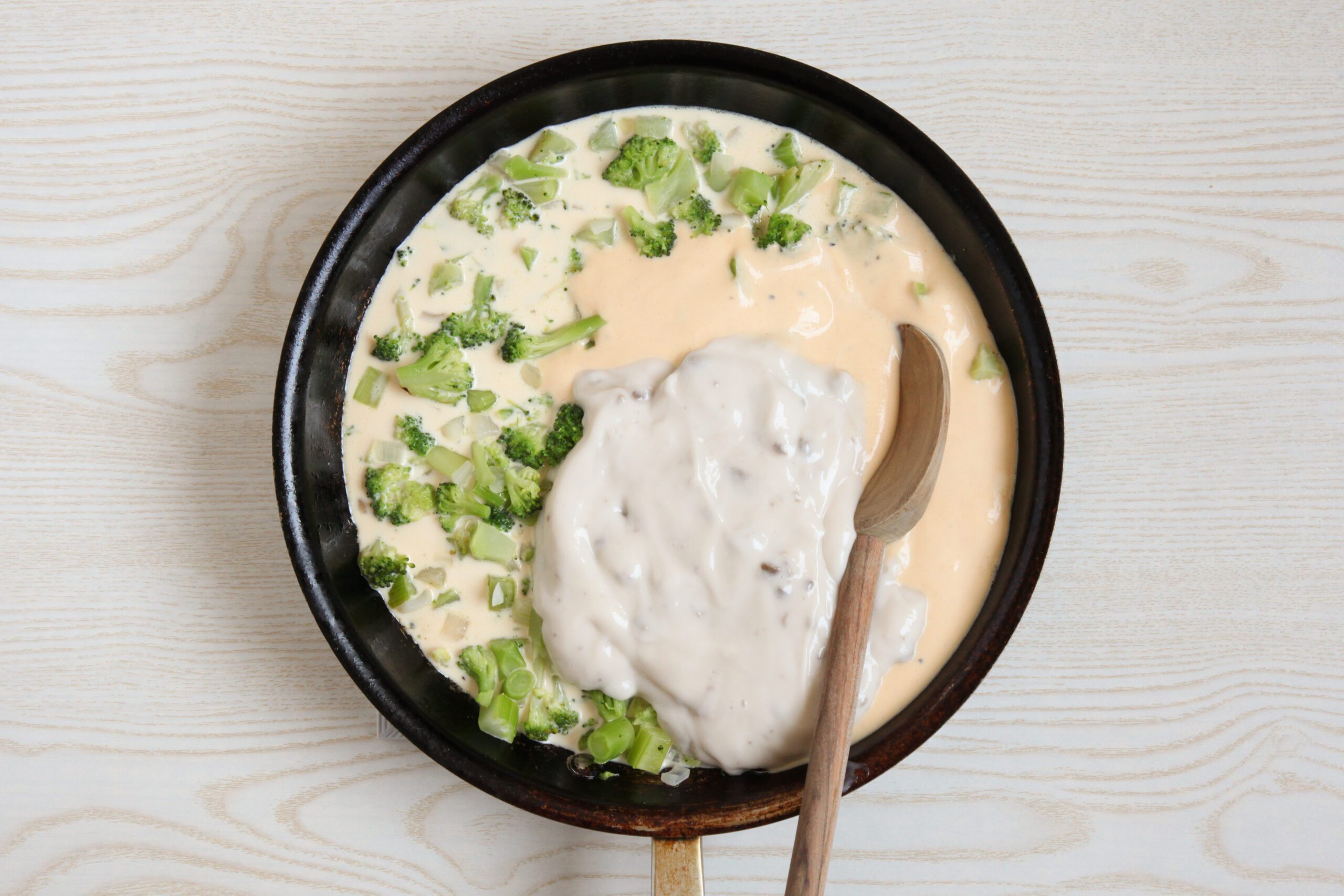 Combining ingredients for broccoli rice casserole base