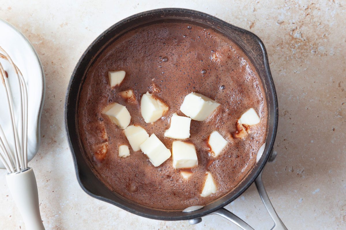 Step 1 of Taste of Home Buttermilk Chocolate Cake is to, combine the cocoa and water until smooth; add butter. Bring just to a boil. Remove from the heat.