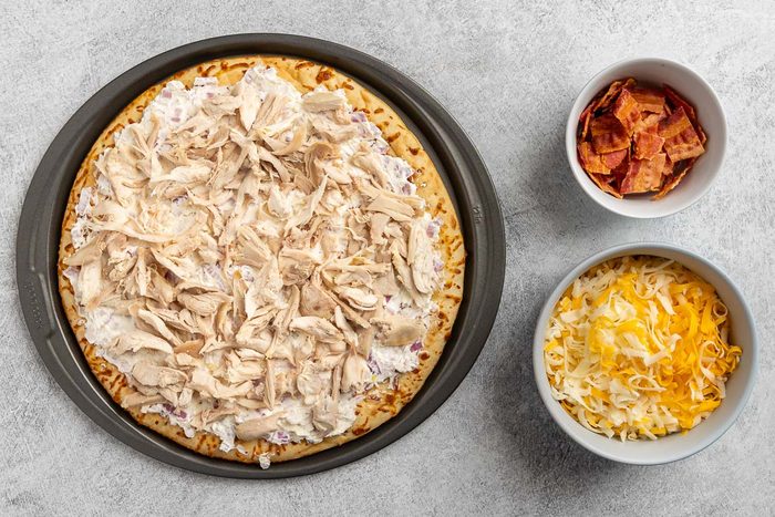 Taste of Home Chicken Bacon Ranch Pizza recipe photo of preparing the pizza crust.