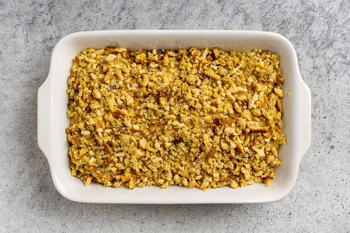 Taste of Home Chicken and Stuffing Casserole recipe photo of stuffing sprinkling atop the chicken and baked in the oven.