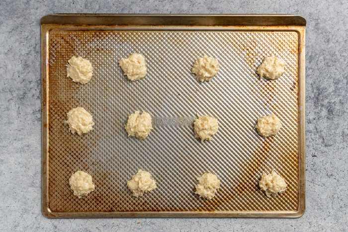Taste of Home Coconut Macaroons recipe photo of dough portioned out into balls and set on a cookie sheet.
